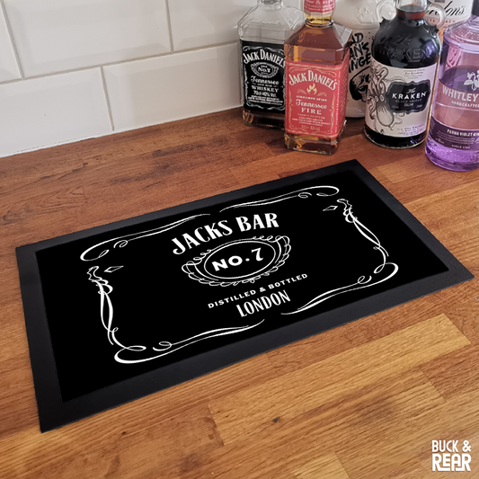 Personalised Jack Daniels bar mat on a counter top
