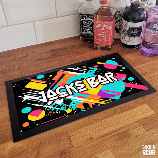 Personalised 80's bar mat on a counter top