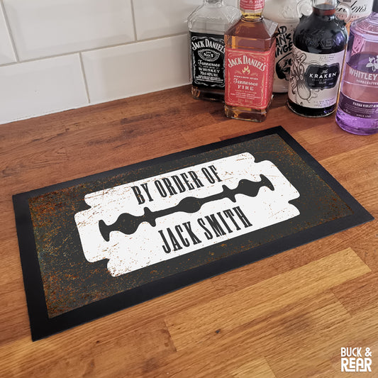 Personalised By Order Of bar mat on a counter top