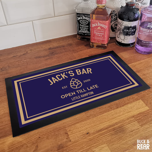 Personalised Pine Cone bar mat on a counter top