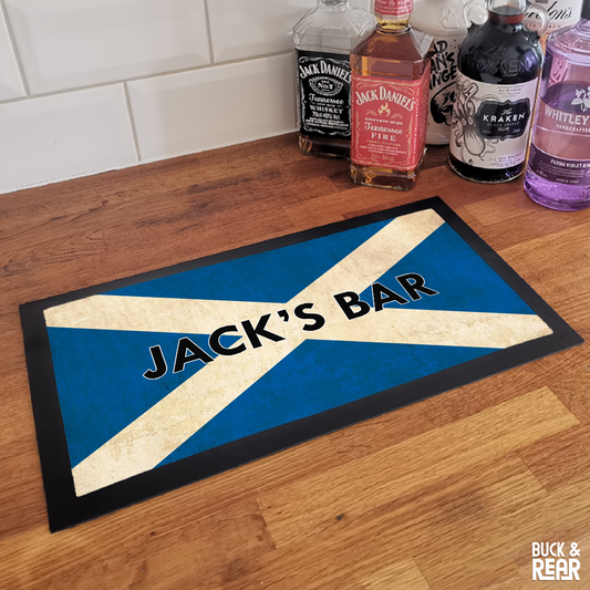 Personalised Scotland bar mat on a counter top